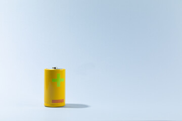 Top view of alkaline batteries or NiMH rechargeable cells on blue background