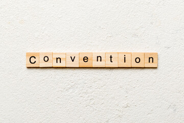 convention word written on wood block. convention text on cement table for your desing, concept