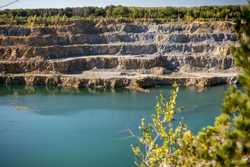 flooded quarry with blue water