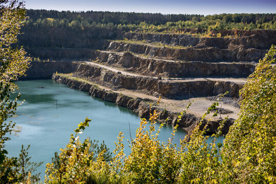 flooded quarry with blue water