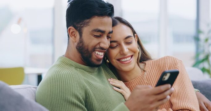 Happy couple, hug and love with cellphone on sofa to scroll on social media, online notification and blog post. Young man, woman and browsing on smartphone, internet and mobile app together at home