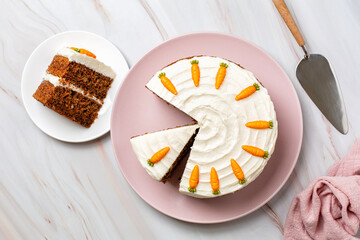 Top view of homemade carrot cake made with carrots, walnuts, cinnamon, iced with cream cheese....