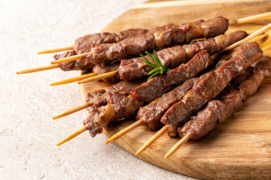  Italian lamb skewers or kebabs cooked on a brazier, with rosemary and spices.  Arrosticini.