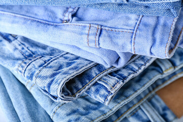 Naklejka premium Folded jeans as background, closeup