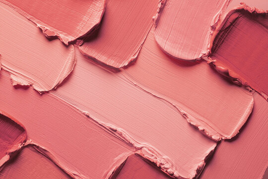 Lipstick or creamy blusher abstract strokes smudges  background texture multi colored red blush background