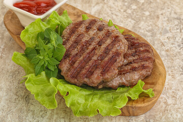 Grilled beef burger cutlet with sauce