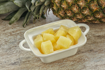Marinated pineapple slices in the bowl