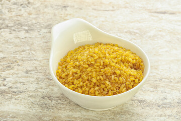 Raw bulgur in the bowl