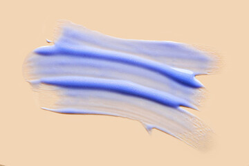 Obraz na płótnie Canvas Lipstick blue blueberry smudge isolated on beige background
