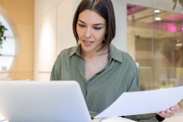 Focused young corporate employee involved in work