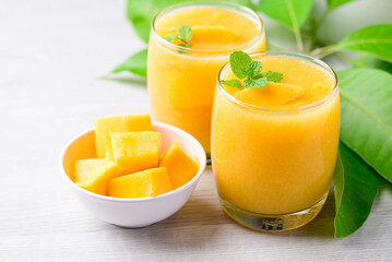 Fresh mango smoothie in glass, Cold drink in summer season