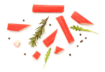 Tasty crab sticks and rosemary on white background © Pixel-Shot