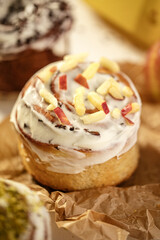 Closeup on sweet fresh cinnabon bun with apple