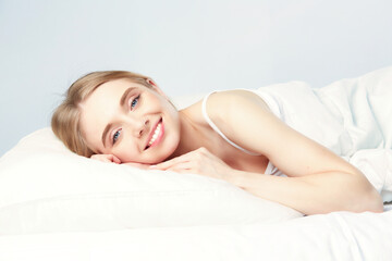 Fototapeta premium Young beautiful girl sleeps in the bedroom.