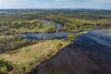 Fototapeta na wymiar panoramic view from a high altitude on river in the forest