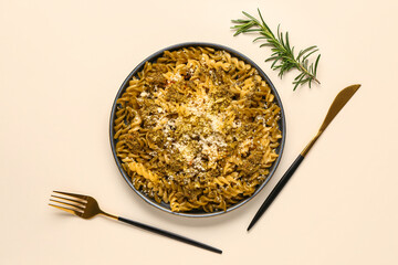 Plate of tasty Italian pasta with Parmesan cheese on white background