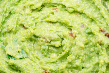 Guacamole sauce texture closeup.