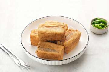 Tahu Bakso, made from tofu filled with meatball dough, served with chili. Indonesian traditional food 
