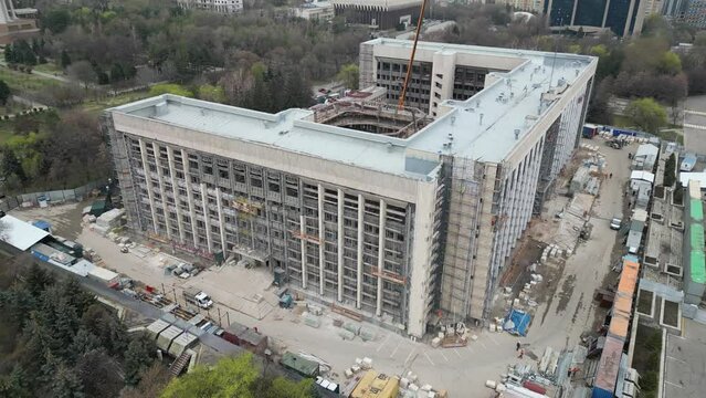  Almaty, Kazakhstan - 03.30.2023 : Reconstruction of the facade of the city Hall, burned during the riots.