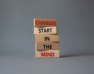 Changes start in the Mind symbol. Wooden blocks with words Changes start in the Mind. Beautiful...