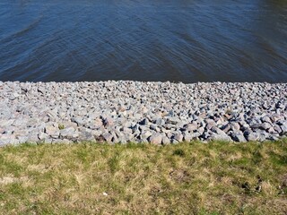 Fortified embankment of the river. Flood protection.