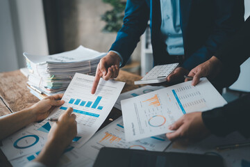 Asian business advisor meeting to analyze and discuss the situation on the financial report in the meeting room.Investment Consultant, Financial , teamwork ,brainstorming ,startup and accounting