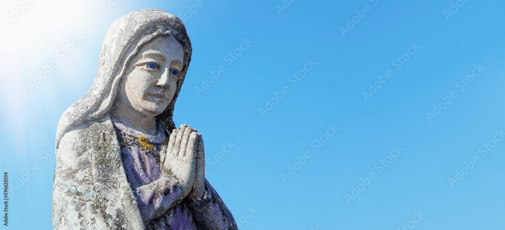 Wall mural antique statue of the virgin mary praying (religion, faith, holy, sin). horizontal image.