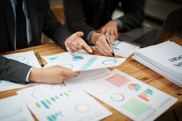 Asian business advisor meeting to analyze and discuss the situation on the financial report in the meeting room.Investment Consultant, Financial , teamwork ,brainstorming ,startup and accounting