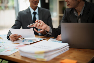 Asian business advisor meeting to analyze and discuss the situation on the financial report in the meeting room.Investment Consultant, Financial , teamwork ,brainstorming ,startup and accounting