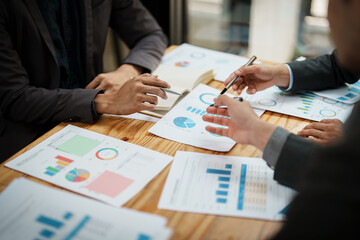 Asian business advisor meeting to analyze and discuss the situation on the financial report in the meeting room.Investment Consultant, Financial , teamwork ,brainstorming ,startup and accounting