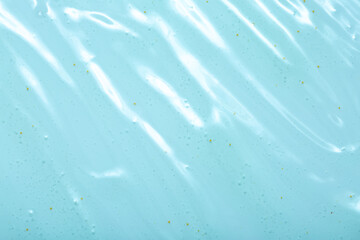 Cosmetic gel close-up with oxygen bubbles. Textured background with microbrushes in cosmetics. Moisturizing skin serum with vitamins and collagen.