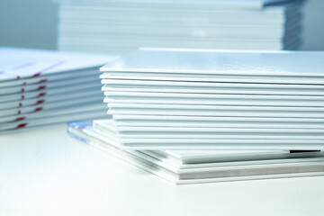 stack of freshly printed photobooks on the table close-up