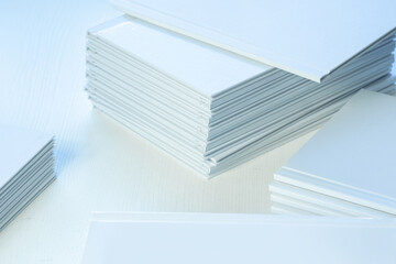 stacks of freshly printed photobooks on the table close-up, clean white cover