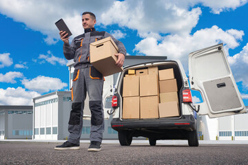 Deliveryman. Man courier with tablet. Employee of logistics company near minivan. Courier under...