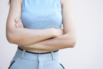 woman standing hugging her waist