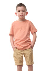 Attractive young boy in pastel t-shirt and shorts on isolated white background.