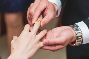 bride and groom holding hands together