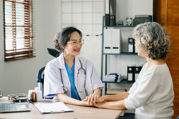 The doctor holds the patient’s. hand Healthcare and medical concept..