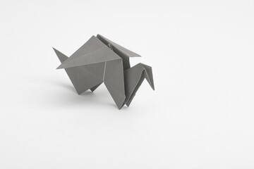 Feeling a little low key today. Studio shot of a grey origami bird.