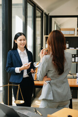 Judge gavel with scales of justice, Business and lawyer or counselor consulting and discussing contract papers with laptop and tablet at law firm