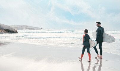 Join us on our surf trip. Shot of a man and his young son at the beach with their surfboards. - Powered by Adobe