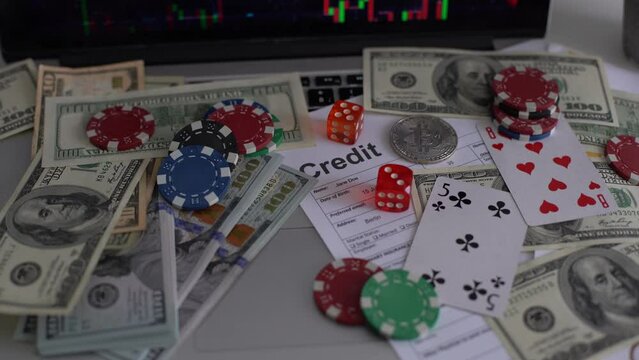 Bitcoin coins with poker cards and chips.