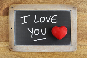 the words 'i love you' written on a slate