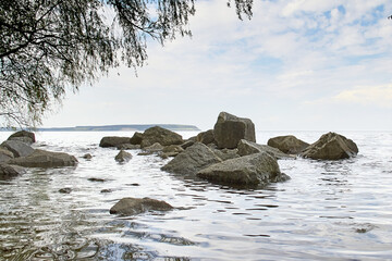 Stones in the water, large stones are washed by the water, seascape