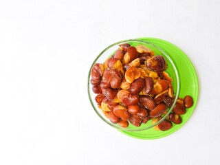 Koro beans or parang beans (Canavalia ensiformis) a traditional snack from Indonesia. Delicious and salty snack. bowl of nuts