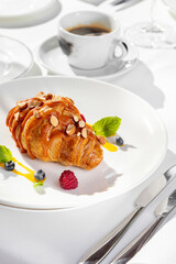 French croissant with caramel and hazelnut on top