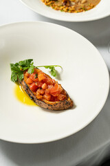 Baked sweet potato with fresh tomatoes