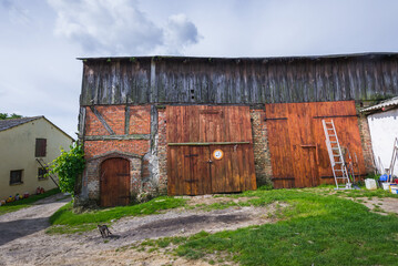 Fototapeta na wymiar Old barn on a farm in village in Gryfino County, Poland