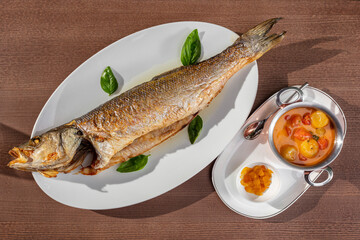 Baked trout and tomatoes in wine sauce
