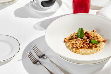 Oatmeal with nuts and mint leaves